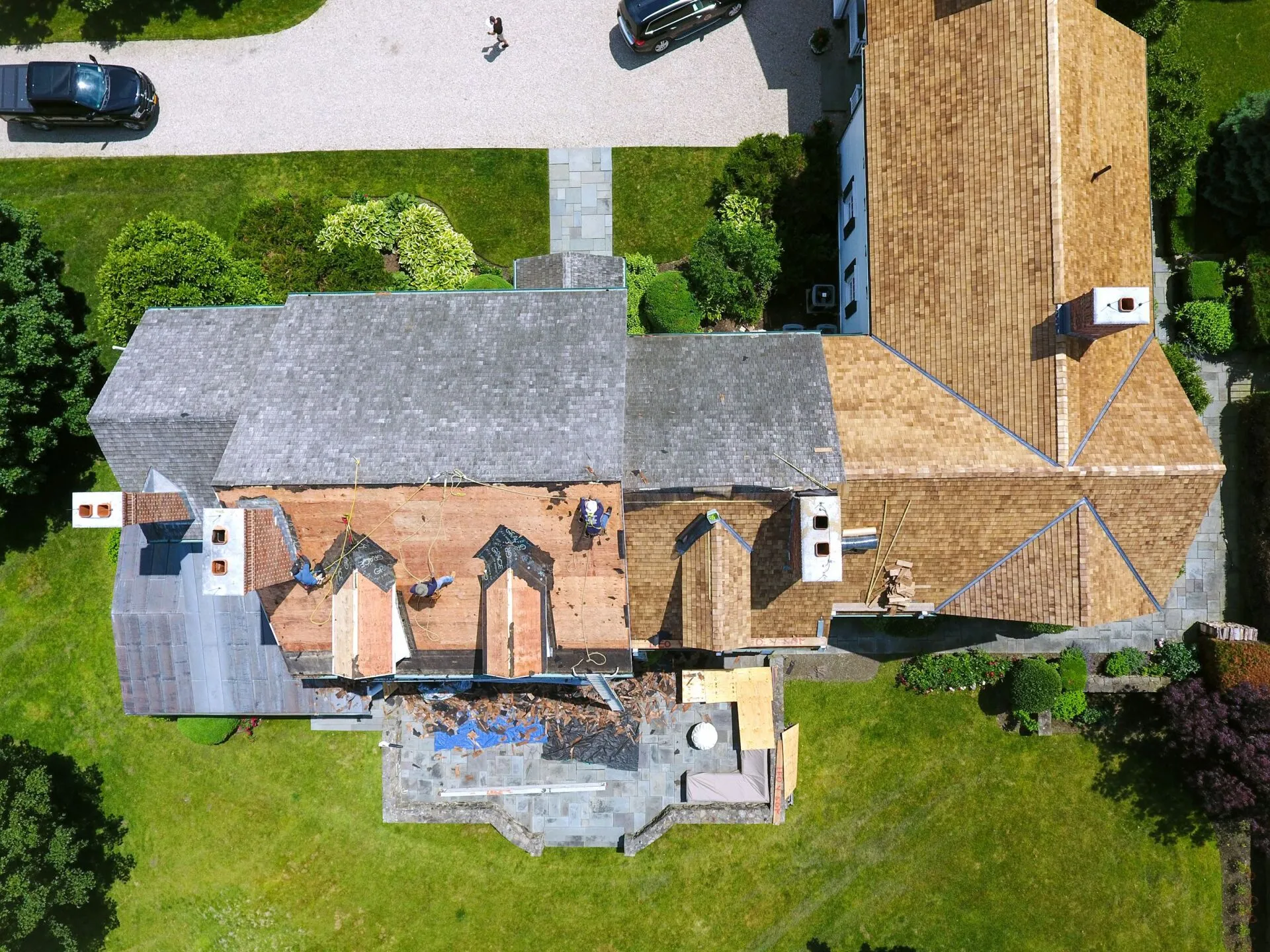 Aerial view of a cedar roof installation in progress