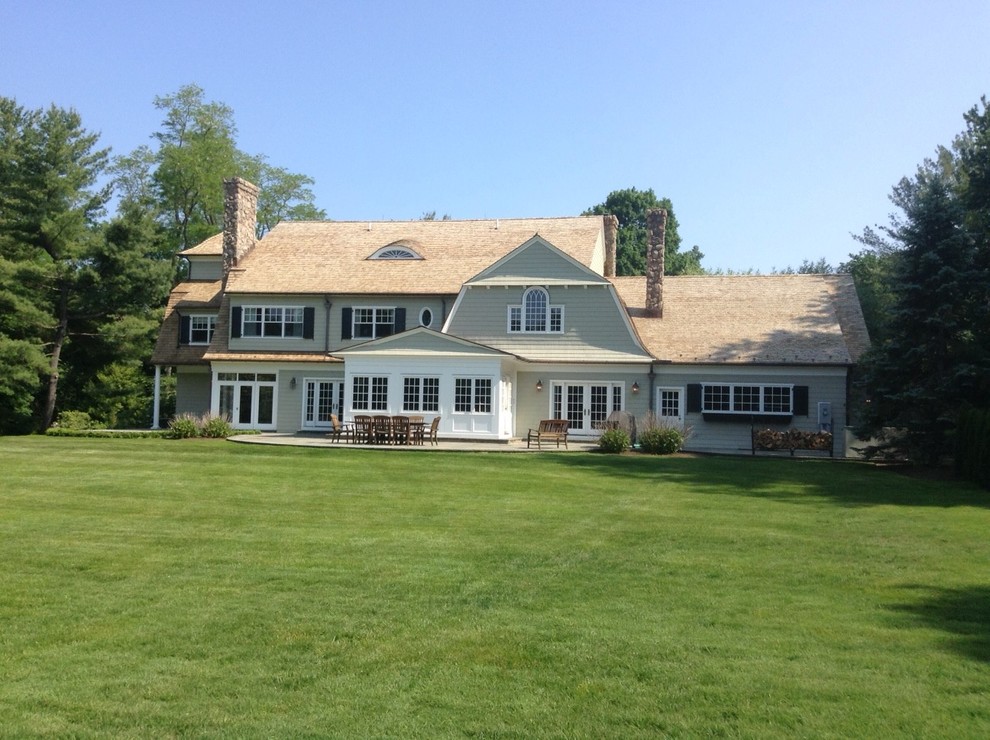 Wide property view featuring a newly installed light cedar roof